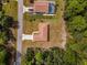 Top-down aerial shot displaying a residence with a long driveway and surrounding greenery at 14550 Sw 61St Ct, Ocala, FL 34473