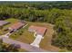 Aerial view of home in lush surroundings, showcasing the neighborhood and landscape at 14550 Sw 61St Ct, Ocala, FL 34473