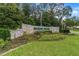 Well-maintained community sign that reads 'Marion Oaks Deed Restricted Community' with manicured lawn at 14550 Sw 61St Ct, Ocala, FL 34473