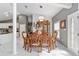 Elegant dining area features detailed wood furniture, marble floors, and ample natural light at 14550 Sw 61St Ct, Ocala, FL 34473