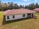 Aerial view of home's exterior with a covered lanai and well-kept yard at 14550 Sw 61St Ct, Ocala, FL 34473