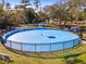 Aerial view of community splash pad surrounded by green grass and park benches at 14550 Sw 61St Ct, Ocala, FL 34473