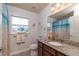 Bathroom with a stained-glass window, granite countertop, and a shower/tub combo at 25 Nw 45Th Loop, Ocala, FL 34475