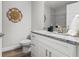 Modern bathroom with granite countertop and white cabinets at 7128 Sw 134Th St, Ocala, FL 34473