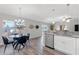 Kitchen and dining area with glass table and four chairs at 7128 Sw 134Th St, Ocala, FL 34473