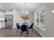 Bright dining area with glass table and four chairs, near kitchen at 7128 Sw 134Th St, Ocala, FL 34473