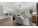 Spacious living room features hardwood floors, an open layout, and a view into the kitchen at 7128 Sw 134Th St, Ocala, FL 34473