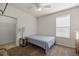 Bright bedroom with carpet, a ceiling fan, and a walk-in closet with shelving at 4560 Sw 52Nd Cir # 101, Ocala, FL 34474
