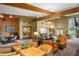 Inviting common area with comfortable seating, dining tables, and large windows at 4560 Sw 52Nd Cir # 101, Ocala, FL 34474