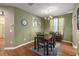 Dining room with a chandelier, horse artwork, and a table with 6 chairs at 4560 Sw 52Nd Cir # 101, Ocala, FL 34474