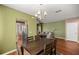 Inviting dining room with hardwood floors, chandelier, and views of the kitchen and living room at 4560 Sw 52Nd Cir # 101, Ocala, FL 34474