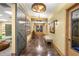 Inviting hallway featuring barn doors, recessed lighting, and stylish decor at 4560 Sw 52Nd Cir # 101, Ocala, FL 34474