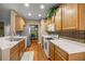 Bright kitchen with stainless steel appliances, oak cabinets, and granite countertops at 4560 Sw 52Nd Cir # 101, Ocala, FL 34474
