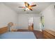 Spacious main bedroom with ceiling fan, plush carpet, and ensuite bathroom at 4560 Sw 52Nd Cir # 101, Ocala, FL 34474