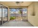 Covered lanai with sliding glass doors and a screened in enclosure at 4560 Sw 52Nd Cir # 101, Ocala, FL 34474
