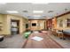 Large rec room featuring air hockey, area, and a TV viewing area with comfortable seating at 4560 Sw 52Nd Cir # 101, Ocala, FL 34474