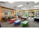 Recreation room with game tables, bar seating, and natural light from the windows at 4560 Sw 52Nd Cir # 101, Ocala, FL 34474