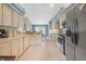Bright kitchen featuring white cabinetry, modern appliances, and an adjacent dining area at 10716 Sw 53Rd Cir, Ocala, FL 34476