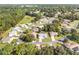 Residential aerial of homes with tree-lined streets and lush landscaping at 11696 Sw 71St Cir, Ocala, FL 34476