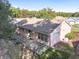Ranch home featuring a screened patio and chain link fence at 11696 Sw 71St Cir, Ocala, FL 34476
