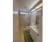 Bathroom with tile flooring, shower, toilet and sink with mirror at 11696 Sw 71St Cir, Ocala, FL 34476