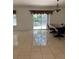 Dining room with tile flooring, sliding glass doors, and chandelier at 11696 Sw 71St Cir, Ocala, FL 34476