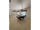 Dining room with tile flooring features a dining table with chairs beneath a pendant light at 11696 Sw 71St Cir, Ocala, FL 34476