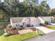 Well-maintained single Gathering home boasting a two-car garage, trimmed hedges, and mulch beds at 11696 Sw 71St Cir, Ocala, FL 34476