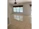 Living room with tile flooring, window, and sliding glass door at 11696 Sw 71St Cir, Ocala, FL 34476