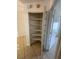 Storage closet with adjustable shelving units inside the home at 11696 Sw 71St Cir, Ocala, FL 34476
