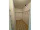 Walk-in closet features shelving and neutral tile flooring providing lots of storage space at 11696 Sw 71St Cir, Ocala, FL 34476