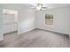 Bright bedroom with neutral walls, a ceiling fan, and an ensuite bathroom at 24381 Nw Falcon Ave, Dunnellon, FL 34432