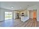 Bright kitchen with stainless steel appliances, granite countertops, and a view of the backyard at 202 Guava Pass, Ocklawaha, FL 32179