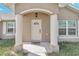 Welcoming front entryway features a classic white door with decorative detailing and sidelight windows at 4414 Sw 170Th Street Rd, Ocala, FL 34473