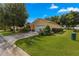 One-story house with a two-car garage and manicured lawn at 9823 Sw 95Th Loop, Ocala, FL 34481