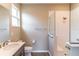 Neutral bathroom featuring a glass enclosed walk-in shower and a modern vanity at 9994 Sw 96Th St, Ocala, FL 34481