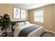 Cozy bedroom features stylish decor, plush bedding, and a bright window at 9994 Sw 96Th St, Ocala, FL 34481