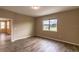 Bedroom with wood floors and a window at 9994 Sw 96Th St, Ocala, FL 34481