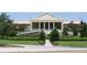 Exterior view of building with Greek-style architecture and landscaped grounds at 9994 Sw 96Th St, Ocala, FL 34481