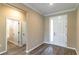 Foyer with neutral walls, updated flooring, and modern entry door with sidelight at 9994 Sw 96Th St, Ocala, FL 34481