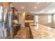 Modern kitchen with stainless appliances, a large island with granite countertops, and plenty of cabinet space at 9994 Sw 96Th St, Ocala, FL 34481