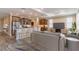 Open concept living area showcasing kitchen with bar seating, stainless appliances, and a comfortable seating area at 9994 Sw 96Th St, Ocala, FL 34481