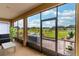 Relaxing screened porch features comfortable seating and views of the picturesque backyard at 9994 Sw 96Th St, Ocala, FL 34481