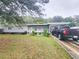 Newly painted house with a spacious yard and a long driveway at 1147 Northcrest Dr, Apopka, FL 32703