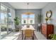 Dining room features a wooden table, and sliding door to patio at 9459 Sw 52Nd Loop, Ocala, FL 34481