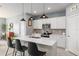 Modern kitchen featuring white cabinets and a large island at 9459 Sw 52Nd Loop, Ocala, FL 34481