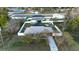 Aerial view of house, fenced backyard, pool, shed, and neighborhood at 147 Juniper Run, Ocala, FL 34480