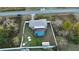 Aerial view showing house, pool, and fenced backyard at 147 Juniper Run, Ocala, FL 34480