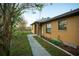 House exterior showcasing walkway and welcome sign at 147 Juniper Run, Ocala, FL 34480