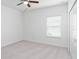 Empty bedroom with gray carpet and window coverings at 7531 Sw 77Th Ave, Ocala, FL 34481